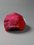 Red cap with a logo on a textured surface